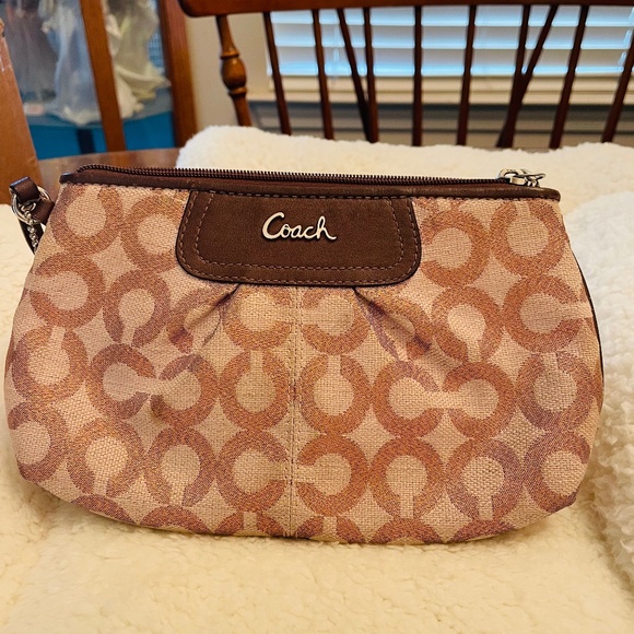 Coach Handbags - Coach Metallic Peach Wristlet